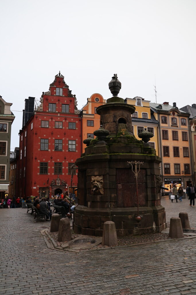 Red merchant house and the old well on Stortorget, Gamla Stan